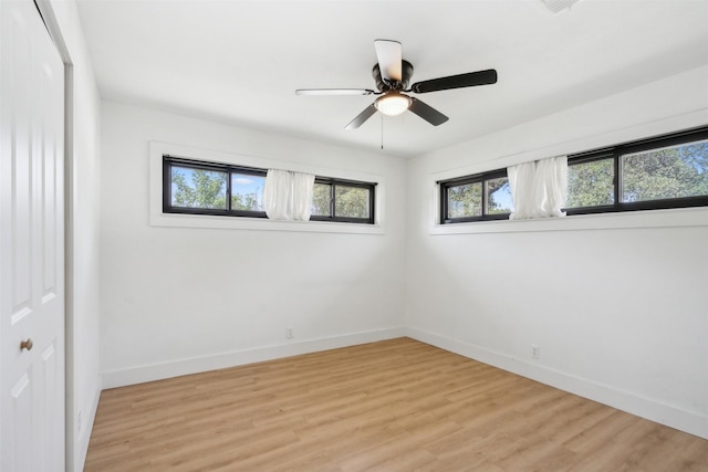 2905 Bilglade Rd, Fort Worth, TX 76133 - empty room with plenty of natural light, baseboards, and light wood-style floors