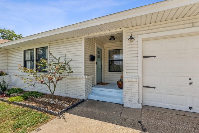 2905 Bilglade Rd, Fort Worth, TX 76133 - view of exterior entry featuring brick siding and an attached garage