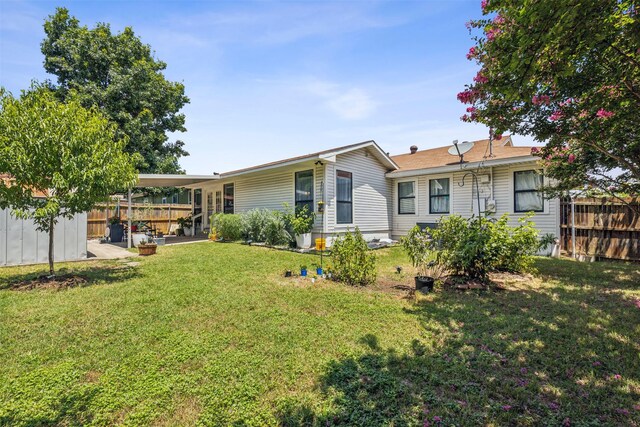 2905 Bilglade Rd, Fort Worth, TX 76133 - rear view of house with a patio area, an outdoor structure, and a storage shed