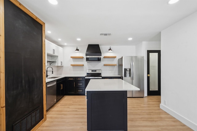 2905 Bilglade Rd, Fort Worth, TX 76133 - kitchen featuring appliances with stainless steel finishes, open shelves, exhaust hood, a sink, and a center island