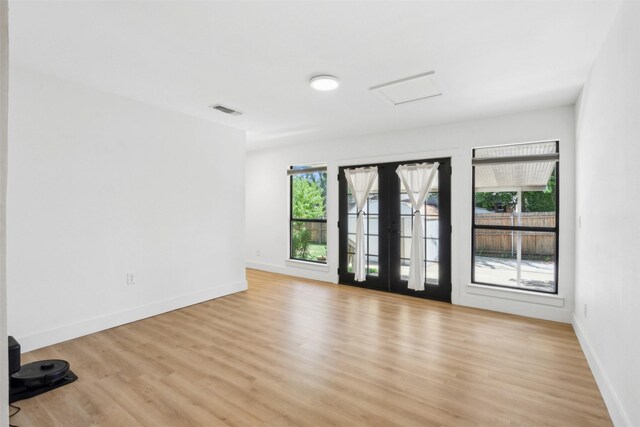 2905 Bilglade Rd, Fort Worth, TX 76133 - spare room with light wood-style flooring, baseboards, and attic access