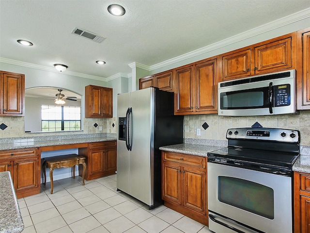 kitchen featuring ceiling fan, ornamental molding, backsplash, and appliances with stainless steel finishes