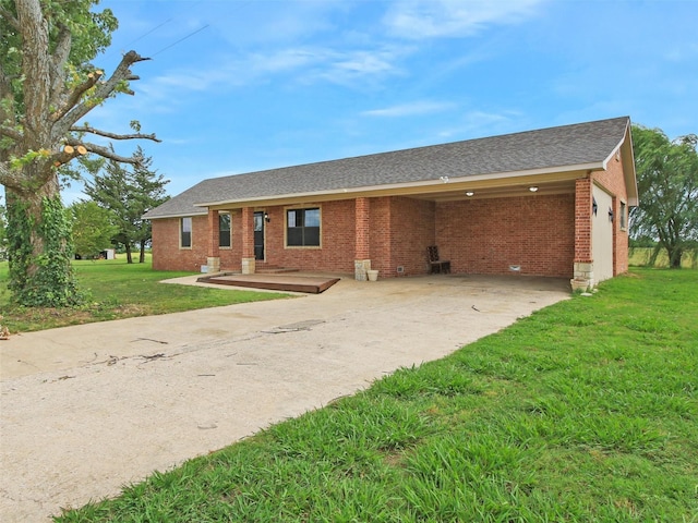 single story home featuring a front lawn and a carport