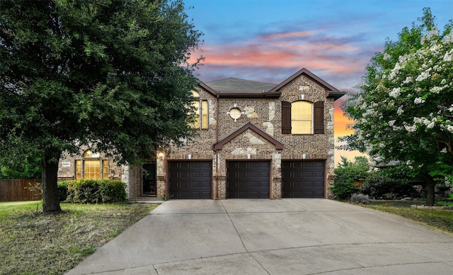 french provincial home featuring a garage