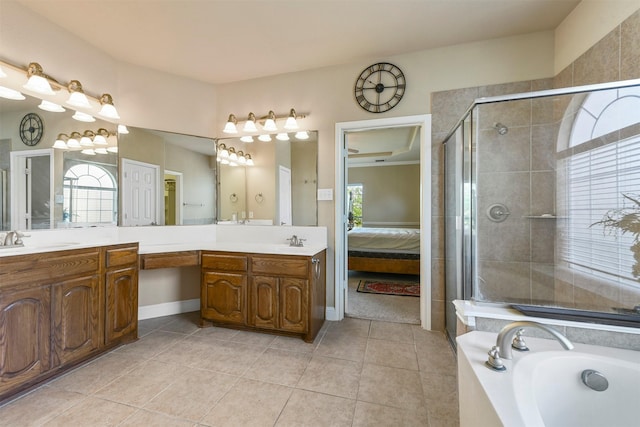 bathroom with tile patterned flooring, vanity, and independent shower and bath