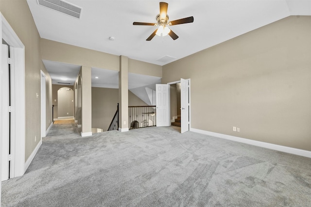 unfurnished living room featuring ceiling fan, light colored carpet, and lofted ceiling