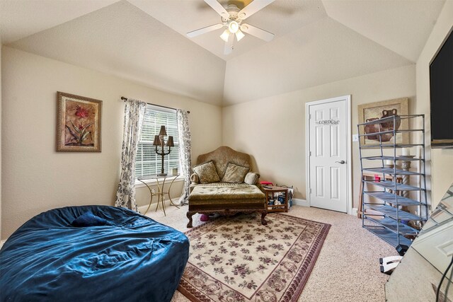 sitting room with ceiling fan, carpet floors, and lofted ceiling