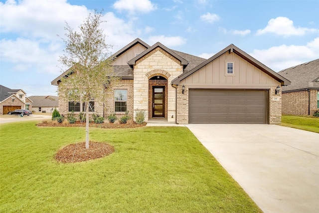 view of front of property featuring a garage and a front yard