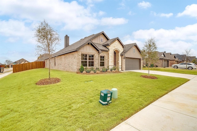 view of front facade with a front lawn and a garage