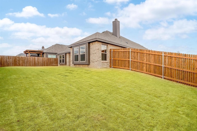 back of house featuring a yard