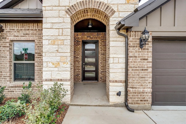 property entrance with a garage