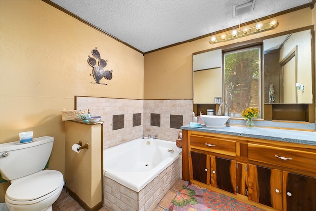 bathroom featuring vanity, a textured ceiling, crown molding, a relaxing tiled tub, and toilet