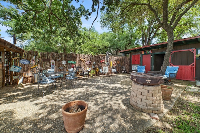 view of patio / terrace featuring a fire pit