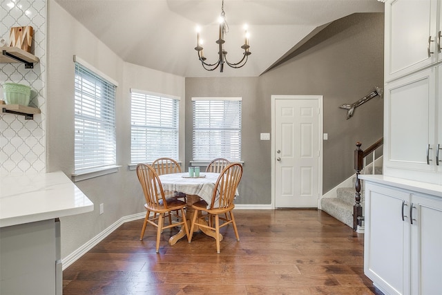 dining space featuring stairs, dark wood-style flooring, and plenty of natural light