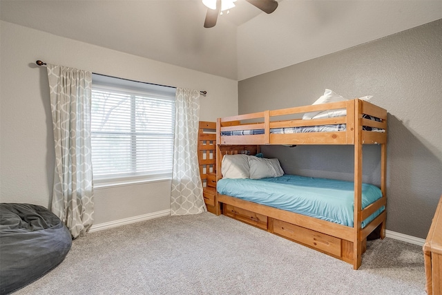 bedroom featuring ceiling fan, carpet floors, and vaulted ceiling