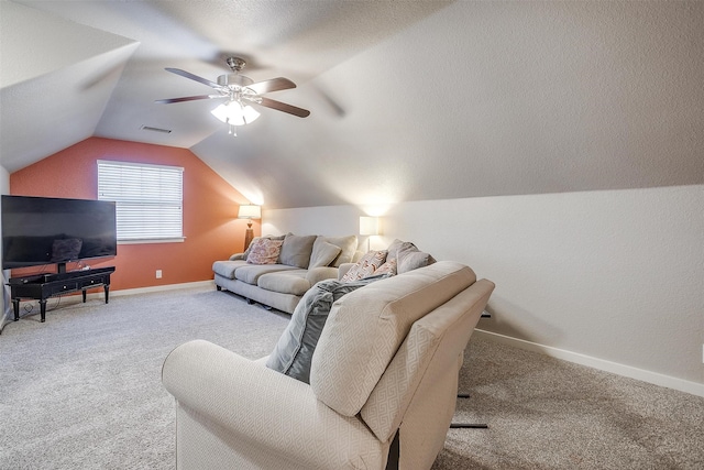 living area with lofted ceiling, carpet flooring, visible vents, and baseboards