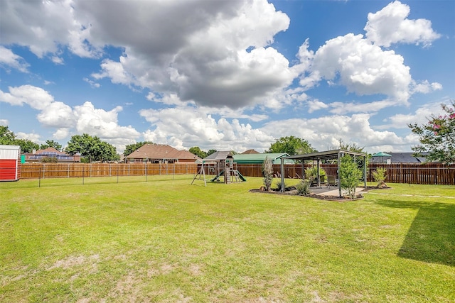 view of yard featuring a patio area, a playground, and a fenced backyard