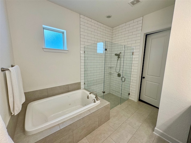 bathroom featuring shower with separate bathtub and tile patterned floors