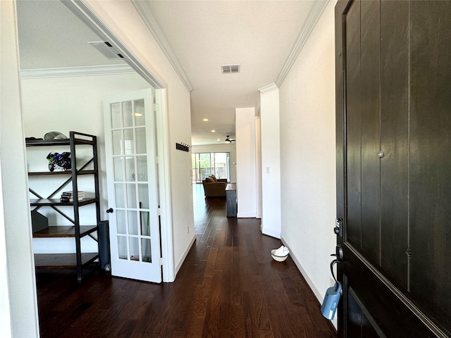 hallway featuring crown molding and dark hardwood / wood-style floors