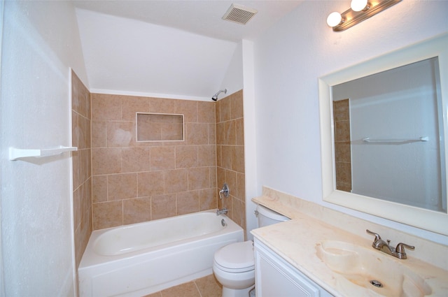 full bathroom with vanity, tile patterned flooring, toilet, tiled shower / bath, and lofted ceiling