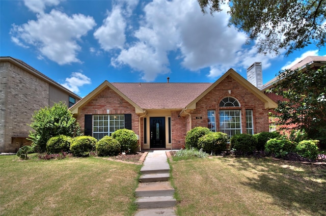 view of front of property with a front lawn