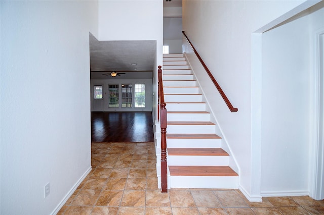 staircase with ceiling fan