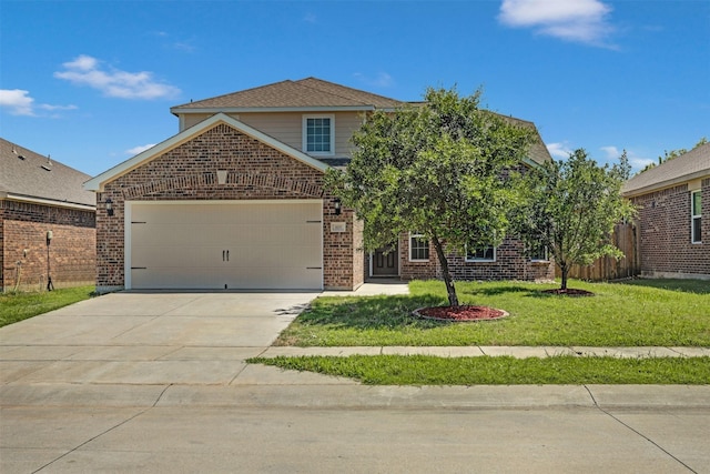 view of property featuring a front yard and a garage