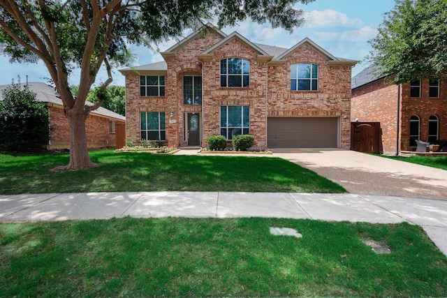 view of front facade with a garage and a front yard