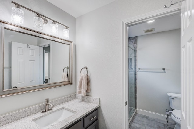 bathroom featuring vanity, toilet, and walk in shower