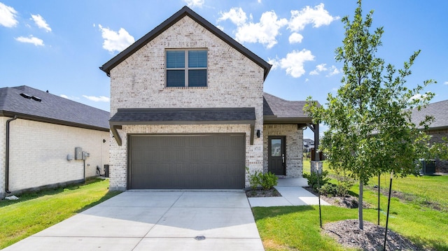 view of front facade featuring central AC unit, a front yard, and a garage