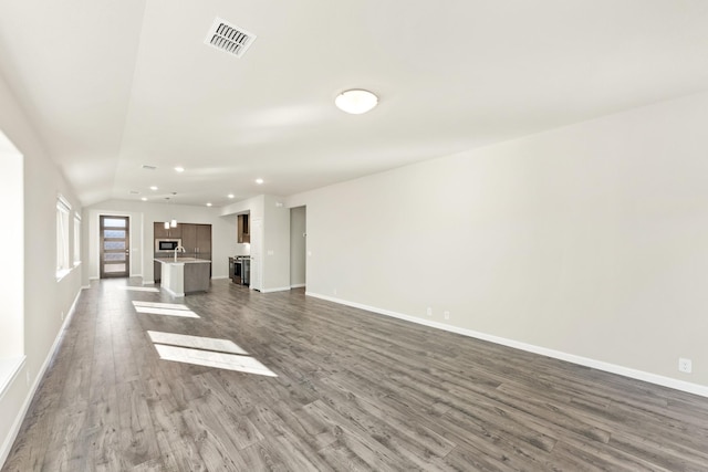 unfurnished living room featuring hardwood / wood-style floors