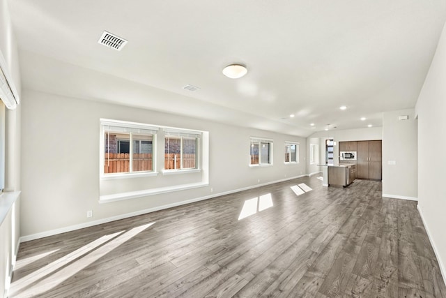 unfurnished living room with dark hardwood / wood-style floors