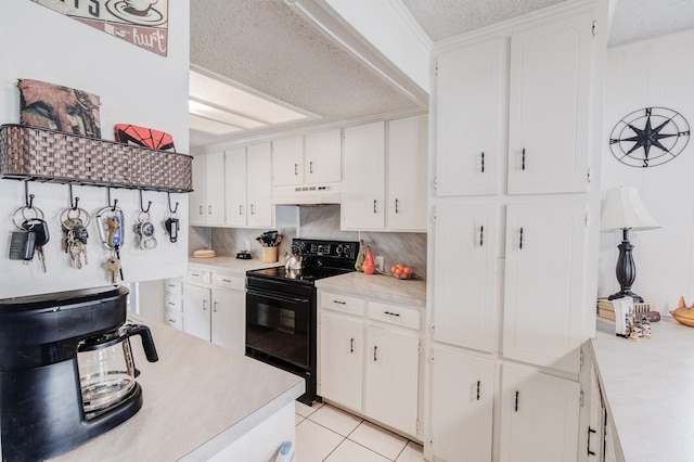 kitchen featuring white cabinets, black range with electric cooktop, tasteful backsplash, and light tile floors