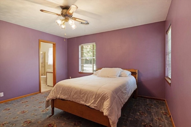 bedroom featuring ceiling fan and ensuite bathroom