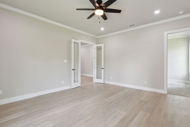 unfurnished room featuring ceiling fan, light hardwood / wood-style flooring, crown molding, and french doors