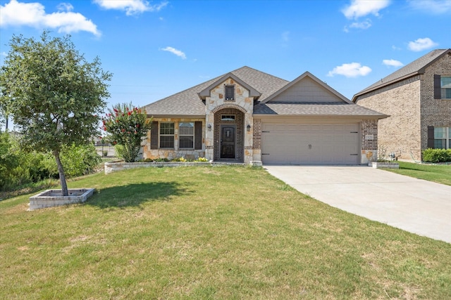 view of front of home with a garage and a front yard