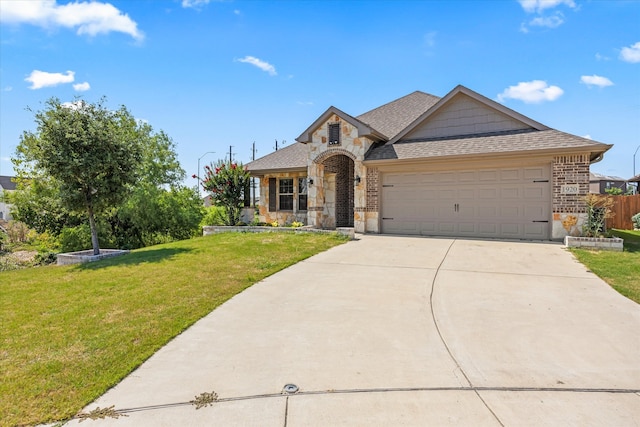 view of front facade with a garage and a front lawn