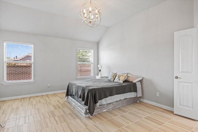 bedroom featuring a notable chandelier and vaulted ceiling