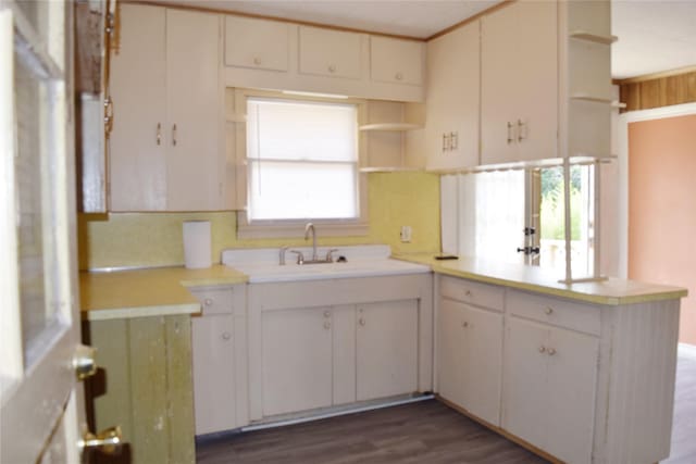 108 W Clinton Ave, Athens, TX 75751 - kitchen with open shelves, a peninsula, light countertops, and plenty of natural light