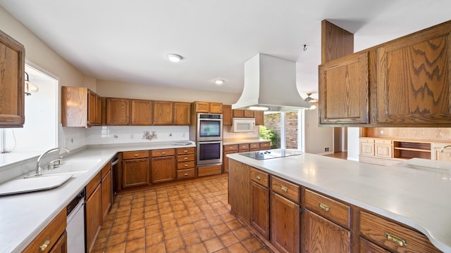 kitchen featuring stainless steel appliances, tasteful backsplash, custom exhaust hood, sink, and light tile floors