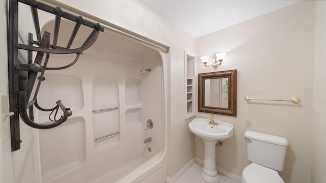 bathroom featuring tile patterned floors, toilet, and bathing tub / shower combination