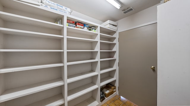 spacious closet featuring tile floors