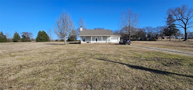 view of front of house with a porch and a front lawn