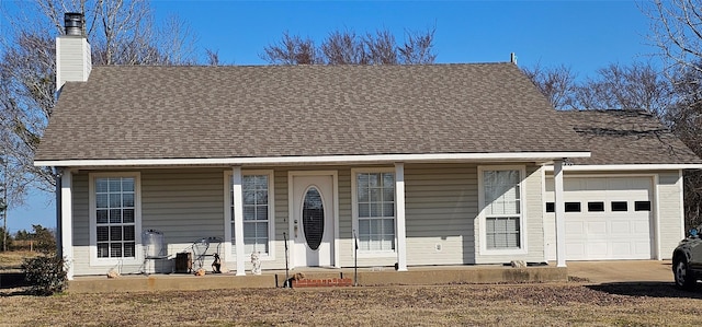 view of front of property with a garage and covered porch