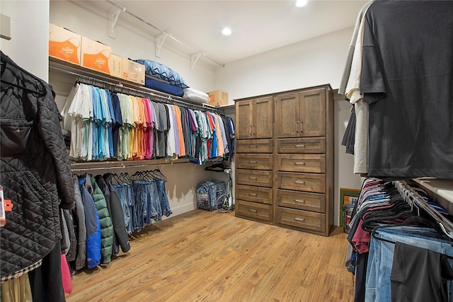 spacious closet featuring light hardwood / wood-style flooring