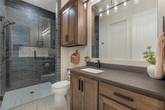 bathroom with vanity, toilet, and walk in shower