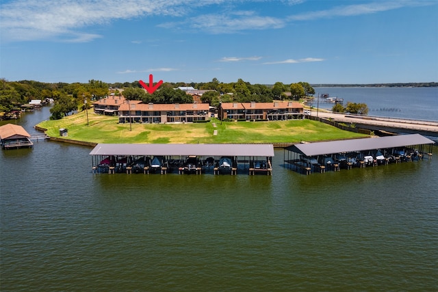 birds eye view of property with a water view