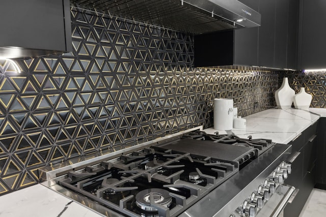 details with tasteful backsplash and stainless steel cooktop