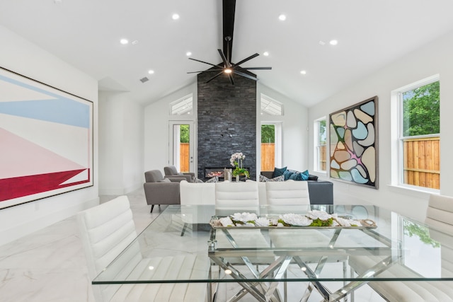 dining area featuring ceiling fan and lofted ceiling