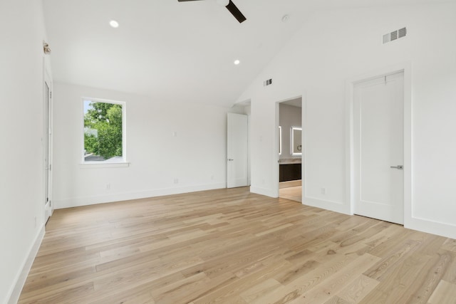 unfurnished room featuring ceiling fan, high vaulted ceiling, and light hardwood / wood-style floors